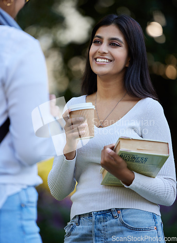 Image of Smile, break or students talking at park on university campus for learning, education or books together. Girls talking, happy or students relax with coffee meeting for research or college knowledge