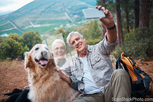 Image of Couple, hiking and dog selfie outdoor in nature for exercise, fitness and trekking for health and wellness. Happy senior man and woman with pet animal on hike in forest for workout, cardio and memory