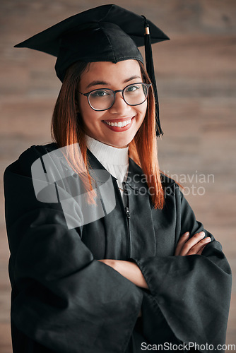 Image of Graduation cap, proud portrait and woman isolated on wood background happy education, college or scholarship success. Biracial person, university student or graduate with learning knowledge mindset