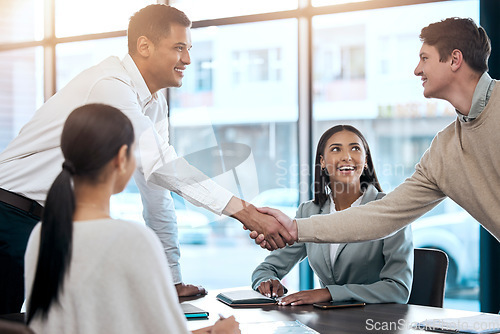 Image of Business people, handshake and meeting for b2b partnership, deal or agreement in corporate recruitment at office. Businessmen shaking hands in teamwork collaboration, hiring or promotion at workplace