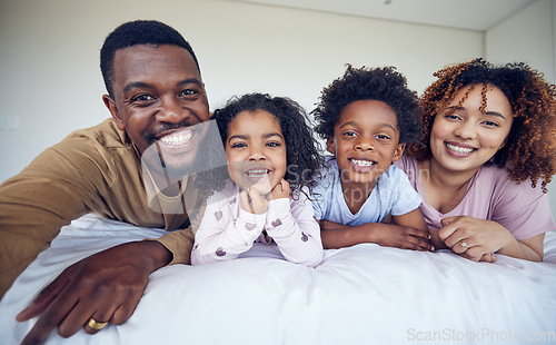 Image of Selfie, portrait and black family relax in bed, smile and cheerful in their home together. Face, photo and children resting indoors with parents, happy and posing for profile picture and memory