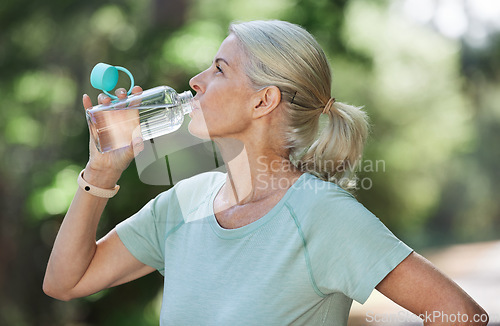 Image of Exercise, workout and senior woman drinking water, park and training for fitness, wellness and healthy lifestyle. Mature female, nature and lady with aqua, retirement practice for energy or cardio