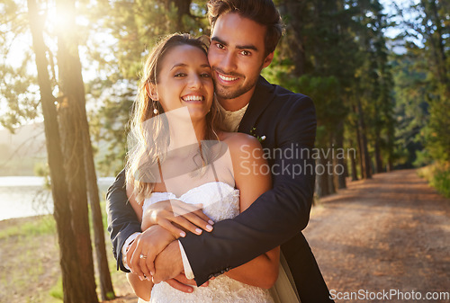 Image of Wedding portrait, couple and hug in park, nature and support of celebration, bridal union or marriage. Happy bride, groom and hugging in garden of love, life partner or celebrate commitment in spring