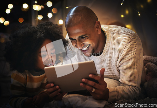 Image of Night, tablet and happy with father and son in blanket tent for connection, relax and streaming cartoon. Smile, app and bonding with man and boy at home for education, internet and online