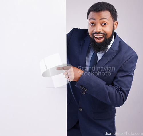 Image of Business portrait, excited man and pointing to board in white background, studio or mockup space. Corporate worker, black male and advertising poster, marketing wow news and banner on blank mock up