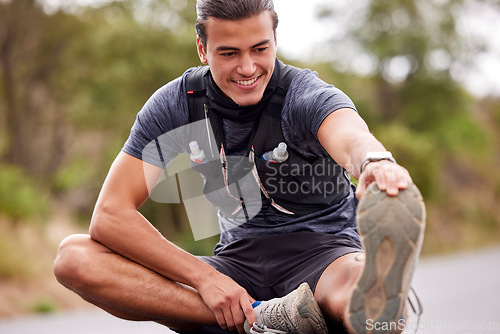 Image of Fitness, man and stretching legs for workout, exercise or training in the nature outdoors. Happy, fit and active male smile in warm up leg stretch to start sport, run or exercising on street or road