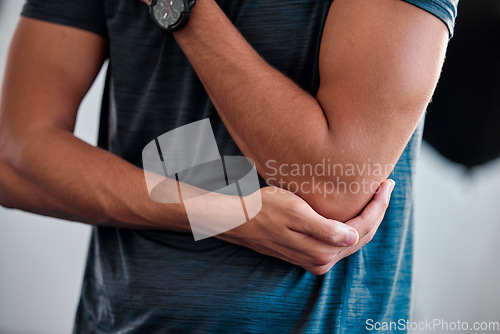 Image of Elbow injury, fitness and man in pain, first aid emergency and health risk of training, accident or wound fracture. Closeup male sports athlete, arm problem and inflammation of body joint in exercise