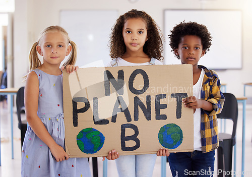 Image of Kids, portrait and poster with friends in protest in a classroom holding a sign for eco friendly activism. Children, green and a kindergarten group standing together for community or ecology