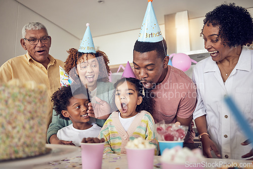 Image of Birthday party, food and surprise with family in kitchen for celebration, bonding and affectionate. Happy, excited and grandparents with parents and child at home for generations, fun or event