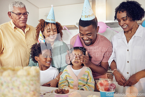 Image of Birthday, party and surprise with family in kitchen for celebration, bonding and affectionate. Happiness, excited and care with parents and child at home for generations, fun and special event