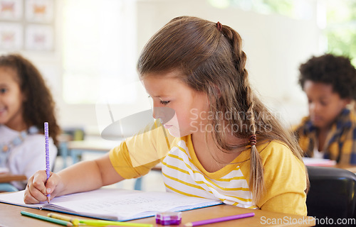 Image of Education, drawing or girl child in classroom learning, exam or studying with preschool notebooks. Development, smart kids or serious student with creative art writing for knowledge in kindergarten