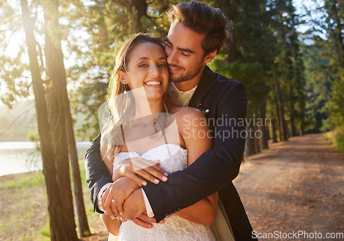 Image of Wedding, love and couple hug in park, forest and nature for celebration of union, care and marriage commitment. Portrait of happy bride, groom and hugging in garden for romance, partner and happiness