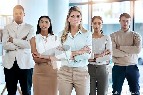 Image of Office, portrait and corporate team with crossed arms for confidence, collaboration and leadership. Diversity, staff and serious business people in collaboration standing together in the workplace.