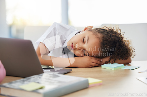 Image of Little girl, sleeping and desk in office with burnout from game, playing and learning in startup. Kid, boss and games in workplace with sleep, fatigue and overworked at table for rest, quiet or peace