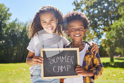 Image of Summer camp sign, portrait or happy kids hug in park together for fun, bonding or playing in outdoors. Board, diversity or young best friends smiling or embracing on school holidays outside in nature