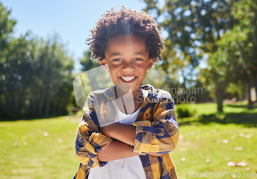 Image of Portrait, arms crossed and black kid in nature, smile and vacation outdoor. Face, happiness and confident boy or child from South Africa having fun or enjoying summer holiday travel at park or garden