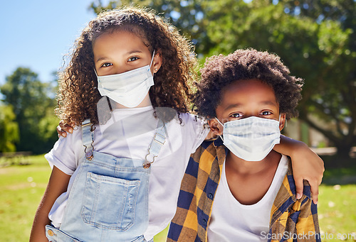 Image of Kids hug, park and mask for covid in portrait with support, care or outdoor in summer sunshine. Children, friends and embrace with girl, safety and solidarity at school, playground and backyard lawn