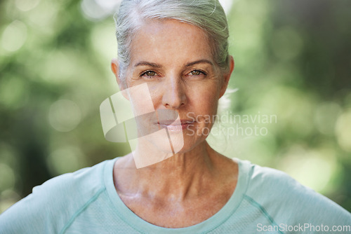 Image of Portrait, exercise and senior woman with confidence, outdoor and training for wellness, healthy lifestyle and balance. Face, mature female and lady with serious workout, and retirement in a park