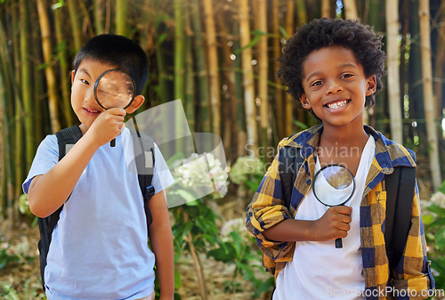 Image of Nature, magnifying glass and portrait of curious children exploring in park for education in sustainability and science. Friends, garden investigation and discovery, kids in summer looking at plants.