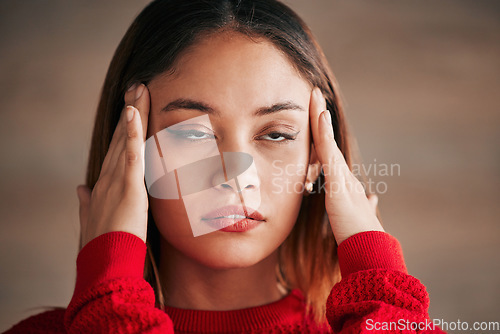 Image of Headache, annoyed and business woman face feeling bored and frustrated from work. Employee, young female and migraine of a worker with a head massage and eye roll with blurred background and stress