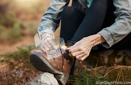 Image of Closeup, hands and tie shoes for walking, hiking and workout for healthy lifestyle, wellness and cardio. Person, hiker and tying shoelace for fitness, training and travel for adventure and fresh air