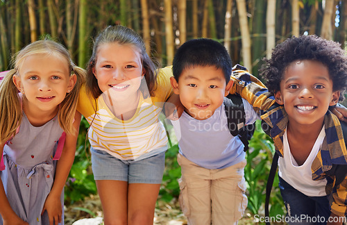 Image of Portrait, friends and kids standing in a line together outdoor, feeling happy while having fun or playing. Diversity, school and smile with children in a row, posing arm around outdoor in a park