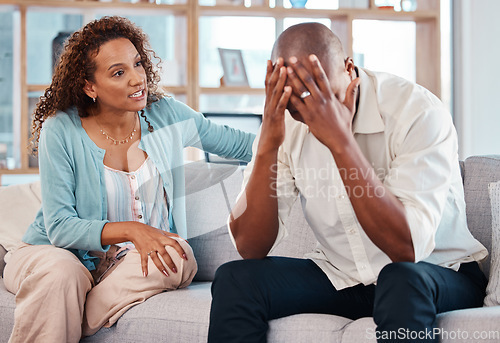 Image of Couple, fight and depression on sofa of marriage problems, breakup or bad communication in lounge. Divorce, crisis and frustrated people argue in conflict, angry partner and anxiety of cheating drama