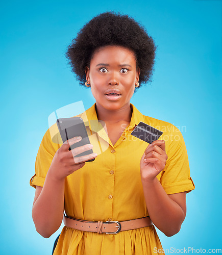 Image of Black woman, phone and credit card with shock, portrait and wow face in studio by blue background. Surprise girl, african or smartphone on online shopping app, e commerce store or amazed for discount