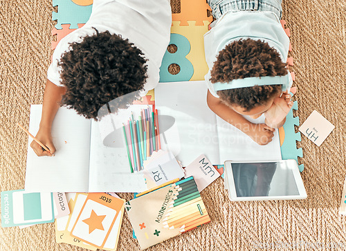 Image of Kids, home education an online knowledge app with children doing elearning and writing activity. Kid video streaming, school student note book and above of a child and sibling together on the ground