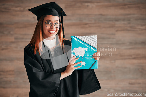 Image of Graduate, woman portrait and business textbook of a young student happy from graduation. Learning book, happiness and excited female ready for university education with a smile from knowledge