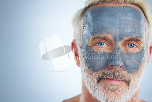 Image of Face mask, skincare and facial with man in studio and mockup for cleansing, detox and spa. Cosmetics, treatment and dermatology with senior model on gray background for anti aging, product or natural