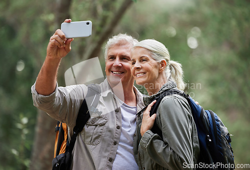 Image of Selfie, hiking and happy mature couple of friends in forest adventure, journey and outdoor health with happy blog update. Nature, travel and trekking people in woods together and profile picture post