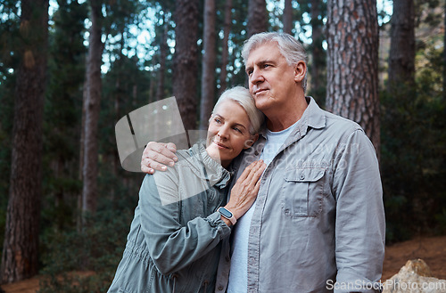 Image of Hug, hike and senior couple outdoor, fitness and bonding in nature, quality time and happiness outside. Wellness, mature man and old woman in forest, exercise and fresh air for healthy lifestyle