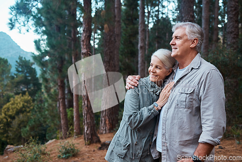 Image of Hug, hiking and senior couple in forest, workout and quality time outdoor, happiness and wellness. Romance, mature man and old woman in woods, walking and fitness for healthy lifestyle and nature