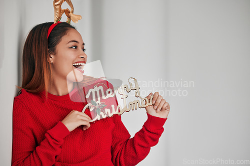 Image of Holiday, christmas sign and woman with mockup holding wood signs with white background and happiness. Wow, excited and isolated female with celebration and a smile from winter celebrating and youth