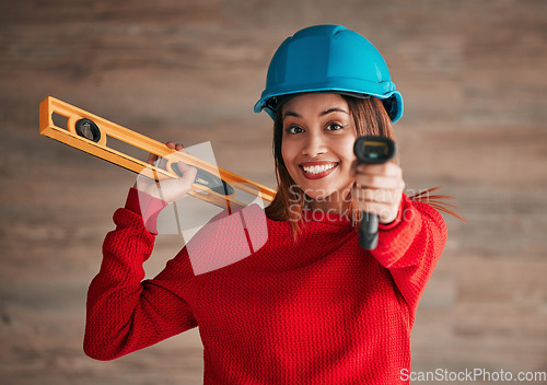 Image of Construction, business woman and portrait of a property management worker with engineer tools. Safety helmet, smile and engineering stud detector for a home renovation project with a female employee