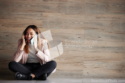 Image of Woman, phone call and space for communication or connection in studio with advertising mockup. Happy female on wooden background laughing at funny conversation or listening and talking on smartphone