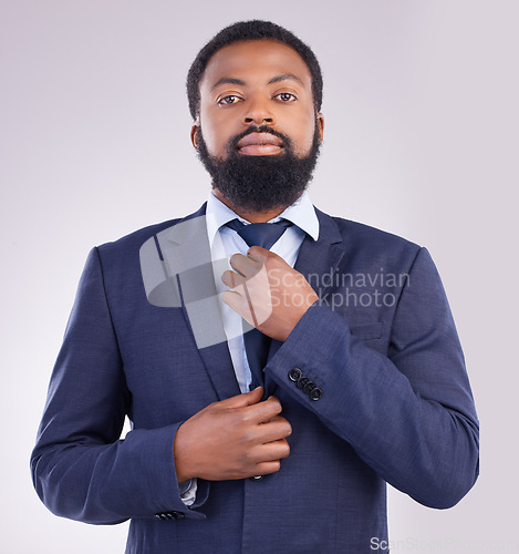 Image of Portrait, business and black man fixing tie in studio isolated on a gray background. Ceo, entrepreneur and confident, proud or serious male professional from South Africa with pride for career or job