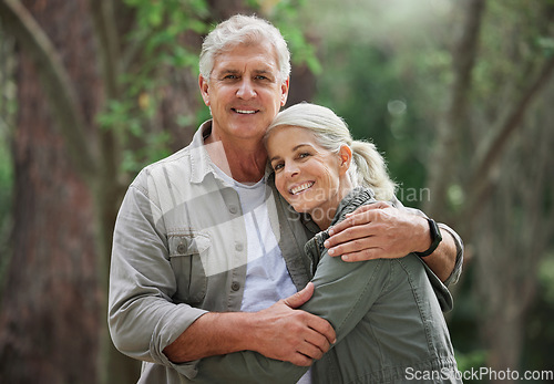 Image of Hug, hiking and portrait of senior couple with smile on adventure in forest, woods and mountain for exercise. Fitness, travel and happy elderly man and woman in retirement, holiday and relax on hike