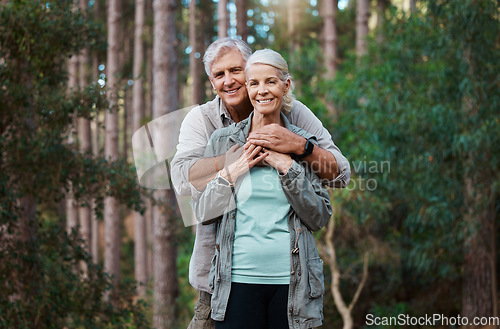 Image of Forest, portrait and senior couple hug for love, retirement wellness and health in nature hiking or travel. Face of happy mature woman and partner or people together in woods, park or countryside