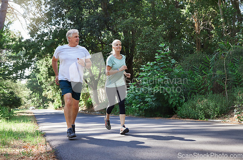 Image of Fitness, senior and a couple running in a park for cardio, retirement exercise and movement. Happy, morning and an elderly man and woman jogging for health, training and active together in nature