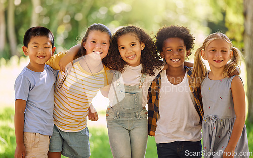 Image of Portrait, friends and children standing in a line together outdoor, feeling happy while having fun or playing. Diversity, school and smile with kids in a row, posing arm around outdoor in a park