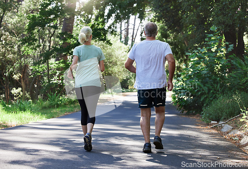 Image of Senior couple, running and back outdoor for exercise, workout and training on road for fitness. Elderly man and woman together for cardio health and wellness on run in nature forest for retirement