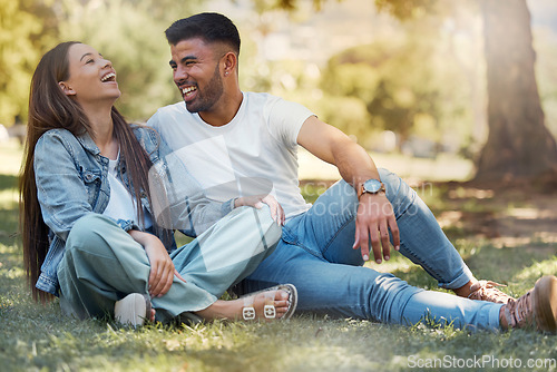 Image of Couple are happy outdoor, laughing and relax together, love and care with trust in relationship and commitment. Happiness, support and freedom with man and woman in park with romance and bonding
