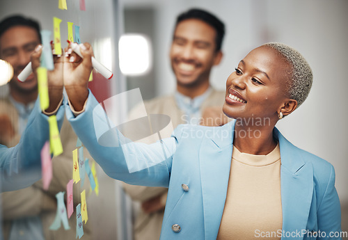 Image of Businesswoman, planning and writing idea in meeting, calendar or agenda, sticky note or innovation. Idea, brainstorming and black woman leader with goal or problem solving, teamwork or solution