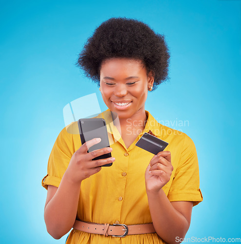 Image of Credit card, happy black woman and mobile in studio for ecommerce payment, fintech money and online shopping. Female model, smartphone banking and finance on internet, technology and retail customer