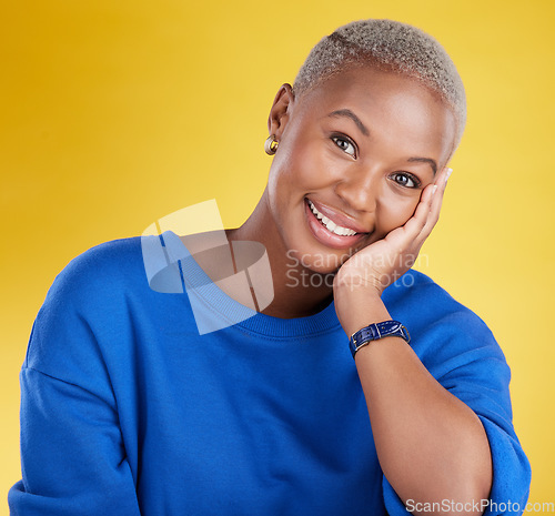 Image of Black woman, face and smile portrait in studio for motivation, beauty and happiness. Young african female model on a yellow background happy about natural cosmetics, positive color and carefree mood
