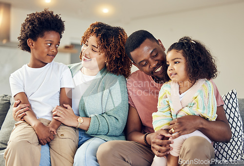 Image of Love, family and bond on a sofa, happy and smile while talking and enjoying a morning in their home. Relax, children and parents on couch together, embrace and loving in living room on weekend