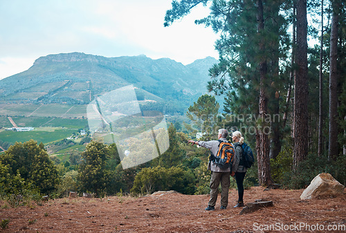 Image of Mountains, view and hiking, old couple pointing at nature on walk in Peru for retirement holiday adventure. Travel, senior man and woman on mountain cliff, peaceful forest hike with love and health.