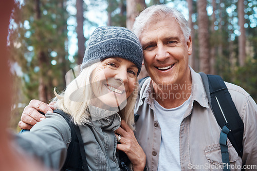 Image of Old couple, selfie and hiking in forest, happy people in portrait, nature and memory for social media post. Smile in picture, adventure and fitness, man and woman with active retirement and outdoor